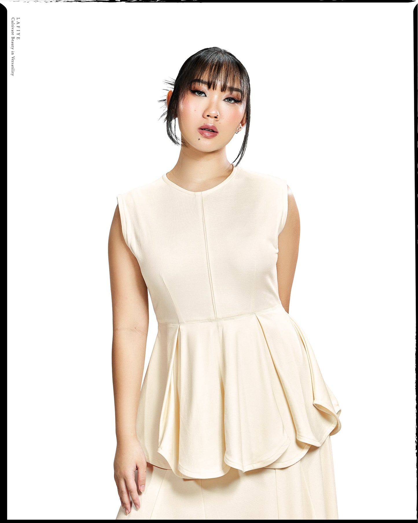 Rho Peplum Top in Clef